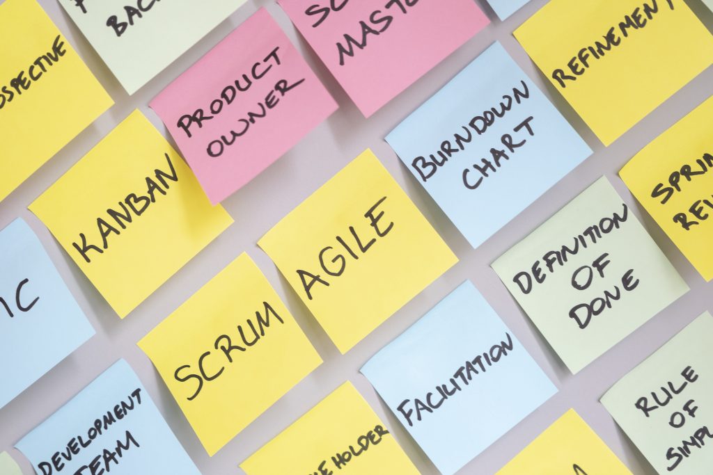 Agile keywords on Post-It notes including Scrum, Agile, Burndown Chart. All Agile Consulting Services provided by APM.